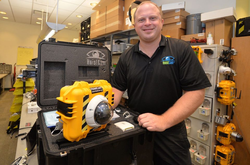 Christopher Machut, Chief Technology Officer, Netarus, LLC. In front, wireless armored dome HoistCam HC180 model on top of rugged transport case.